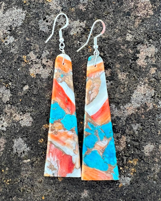 Hand-cut turquoise slab earrings with freeform edges and natural veining.