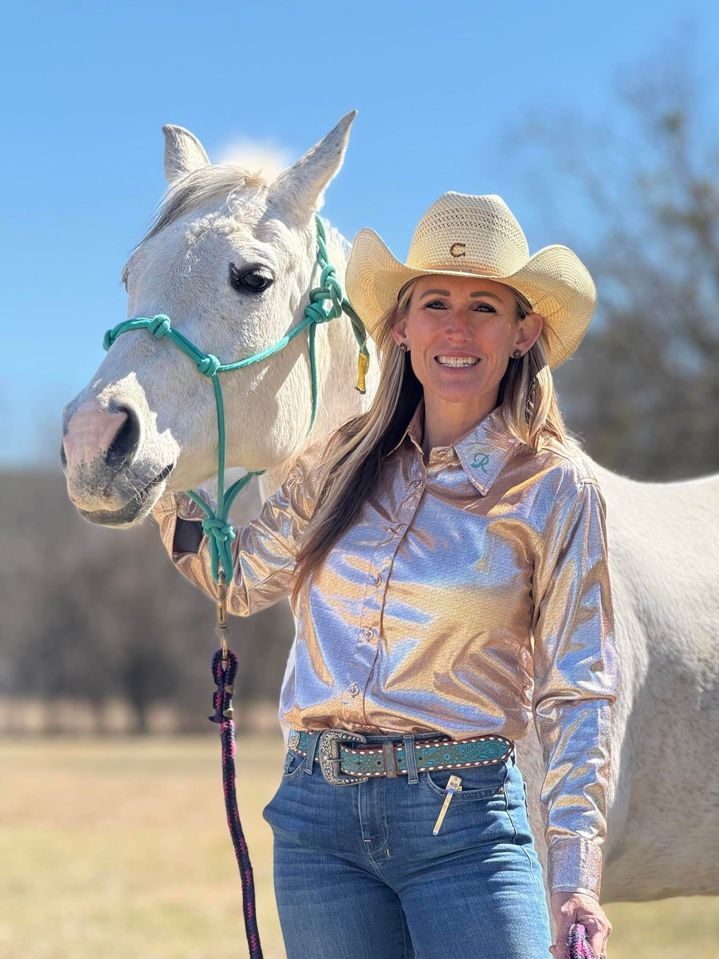 Barrel racer wearing the Golden Hour Show Shirt, a shimmering gold and silver performance top.