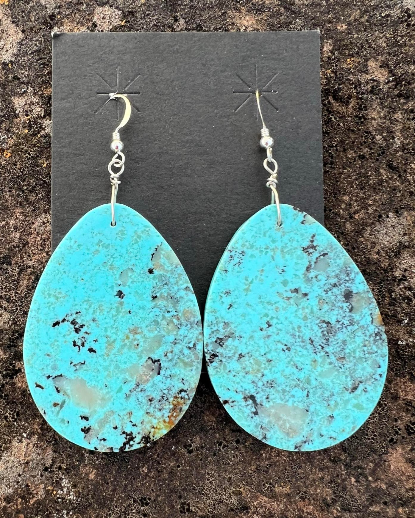 Hand-cut slab turquoise earrings with natural veining, set in a minimalist design.