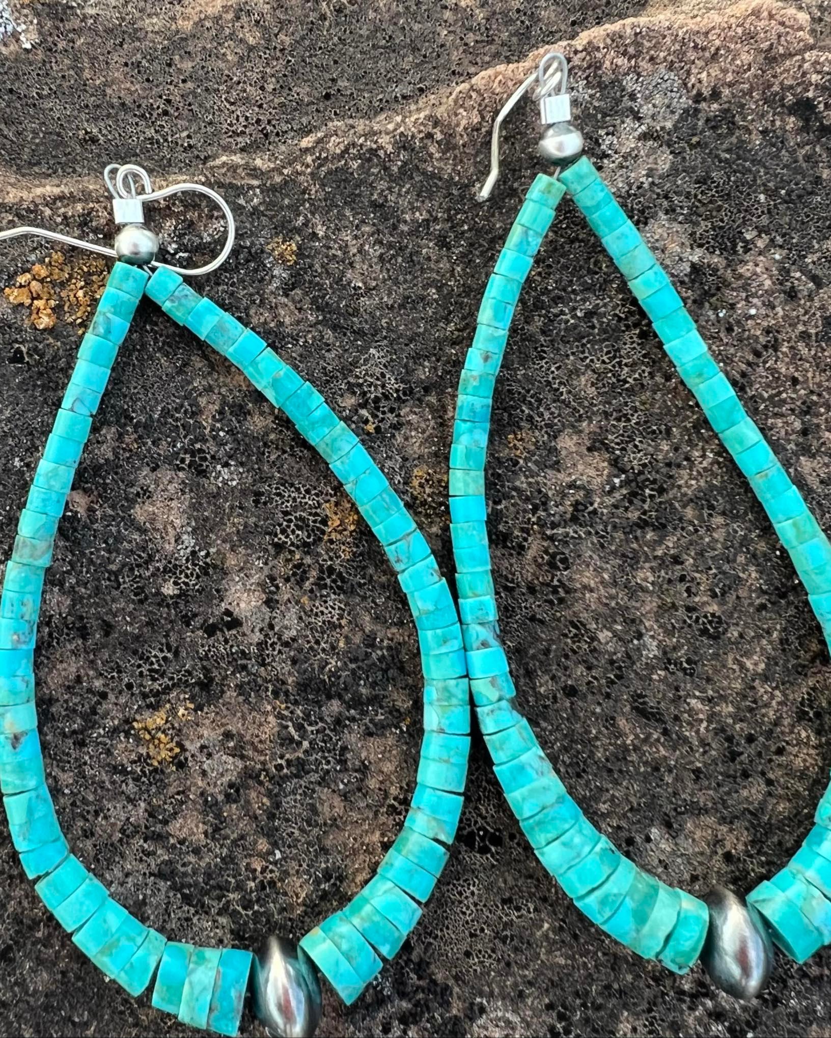 Kingman turquoise rondelle bead earrings with sterling silver accents, showcasing vibrant blue hues.