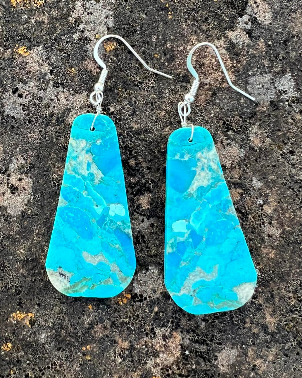 Hand-cut turquoise slab earrings with jagged edges and natural veining.